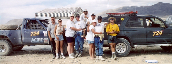 desert race truck and crew next to 4Runner chase vehicle.